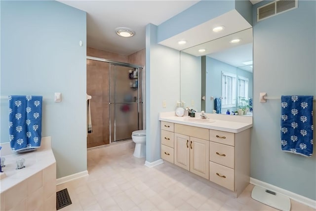 bathroom with visible vents, toilet, a stall shower, and vanity