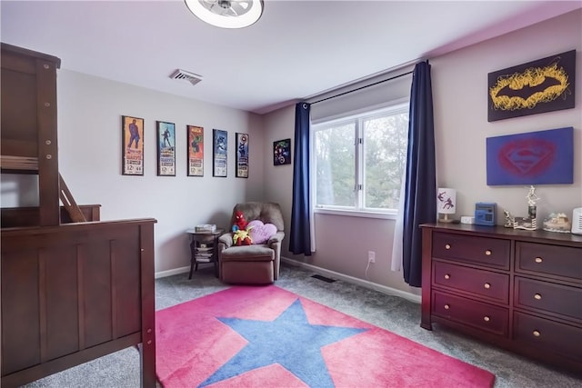 carpeted bedroom featuring visible vents and baseboards