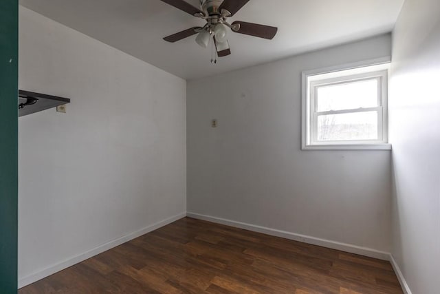 spare room featuring ceiling fan, baseboards, and wood finished floors