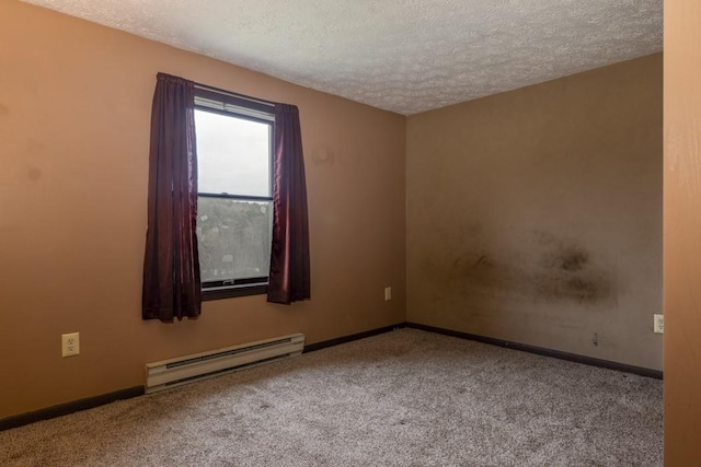 spare room with carpet flooring, baseboards, baseboard heating, and a textured ceiling