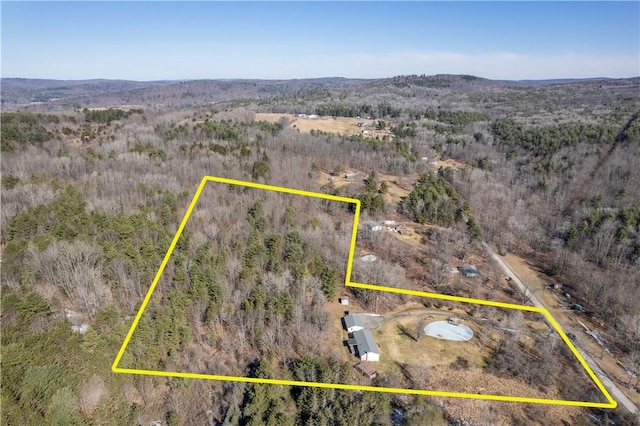 aerial view featuring a forest view