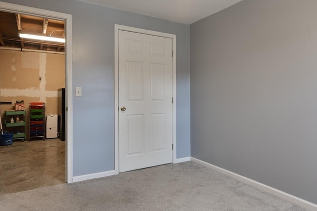 unfurnished bedroom with baseboards and carpet floors