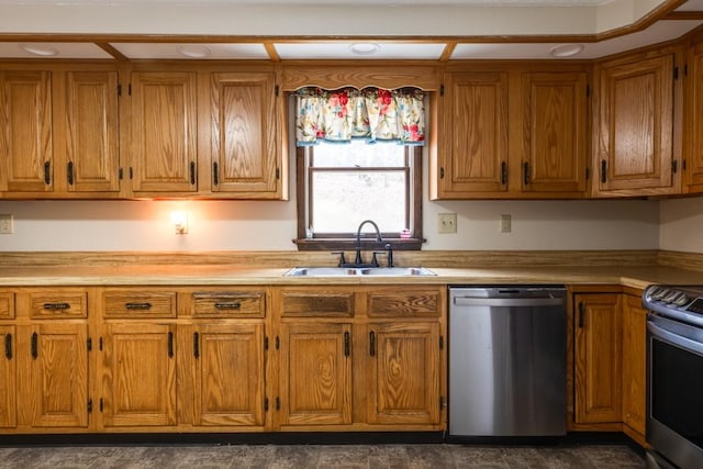 kitchen with brown cabinets, stainless steel appliances, light countertops, and a sink