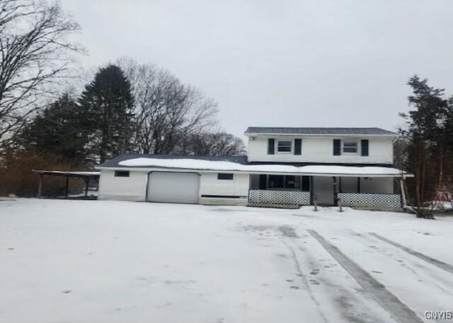 view of front of home featuring an attached garage and covered porch