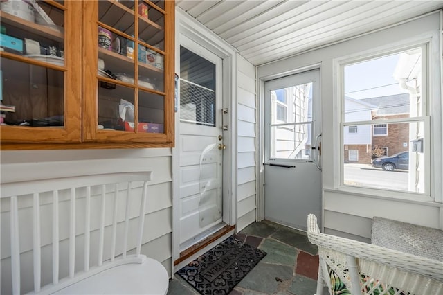 doorway featuring stone finish flooring