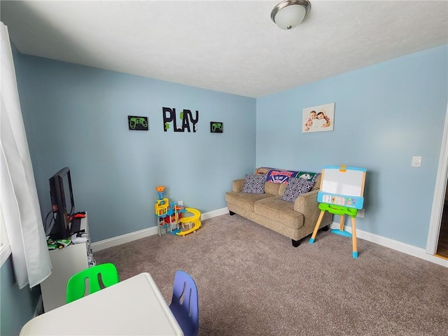 playroom with baseboards and carpet floors