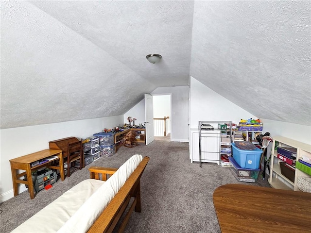 rec room featuring baseboards, carpet floors, a textured ceiling, and vaulted ceiling