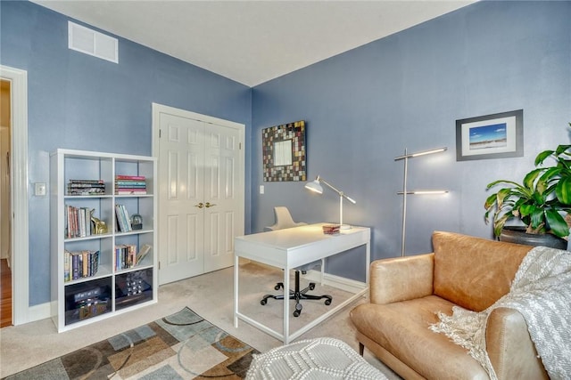 carpeted home office with visible vents