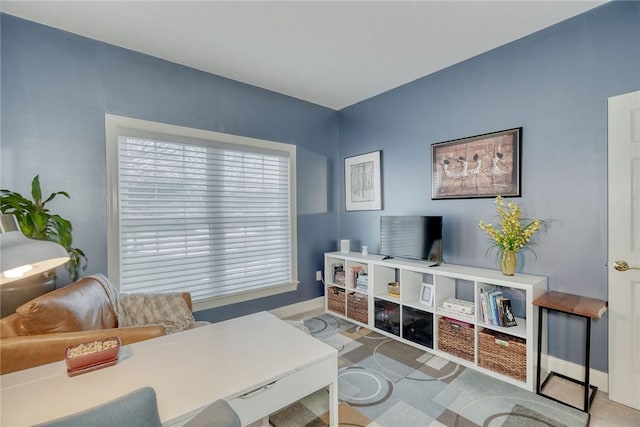 living room with carpet flooring and baseboards