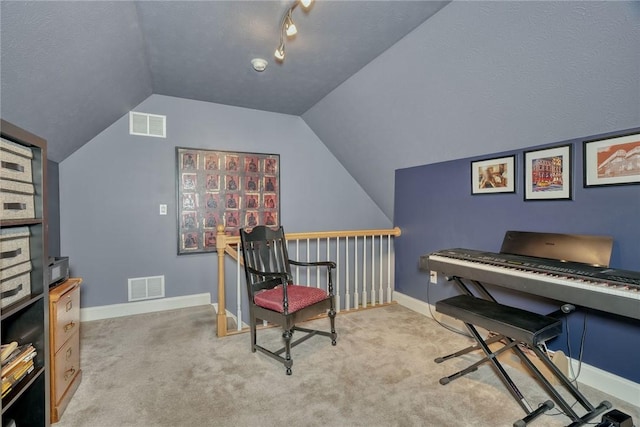 living area featuring visible vents, carpet flooring, and baseboards