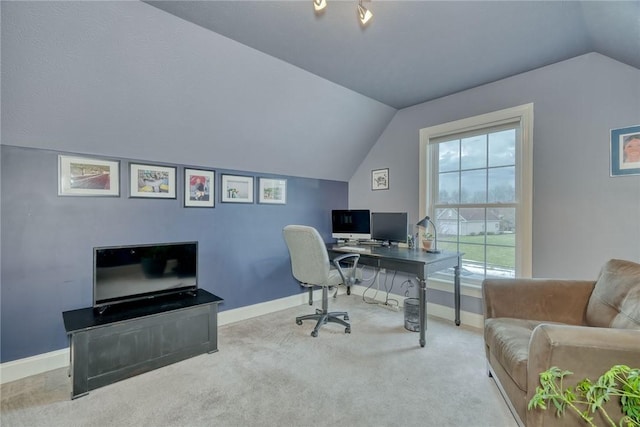 carpeted home office with baseboards and lofted ceiling