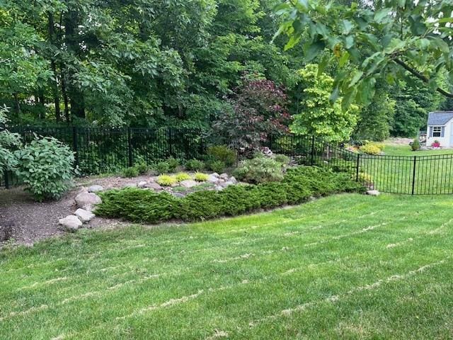 view of yard with a fenced backyard