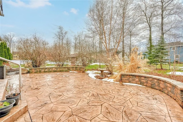 view of patio featuring fence