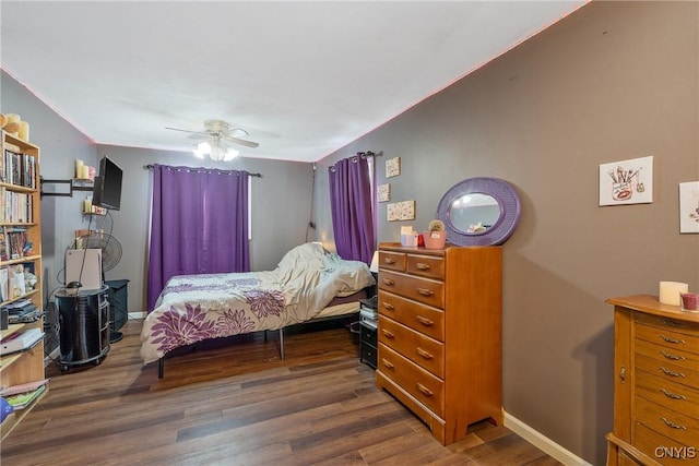 bedroom with wood finished floors, baseboards, and ceiling fan