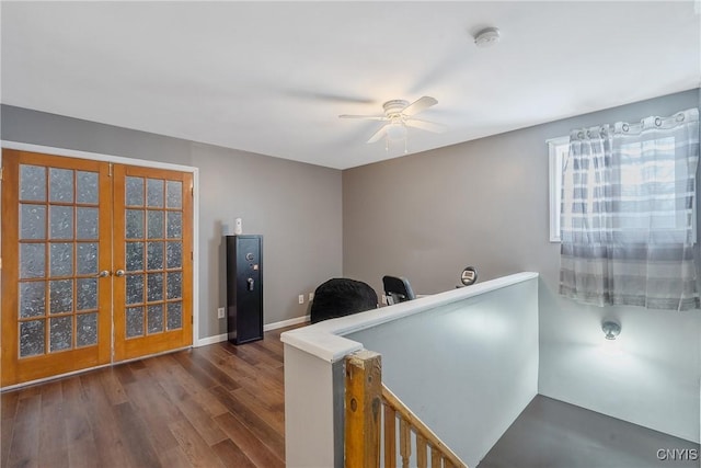 office space featuring french doors, baseboards, a ceiling fan, and dark wood-style flooring