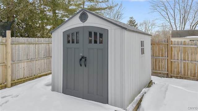 view of shed with a fenced backyard