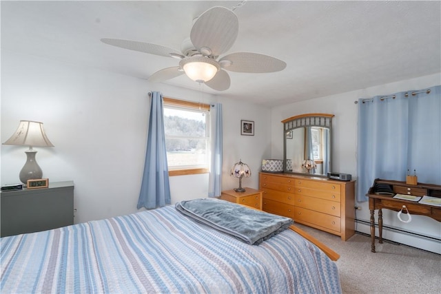 bedroom featuring a baseboard heating unit, a ceiling fan, and light carpet