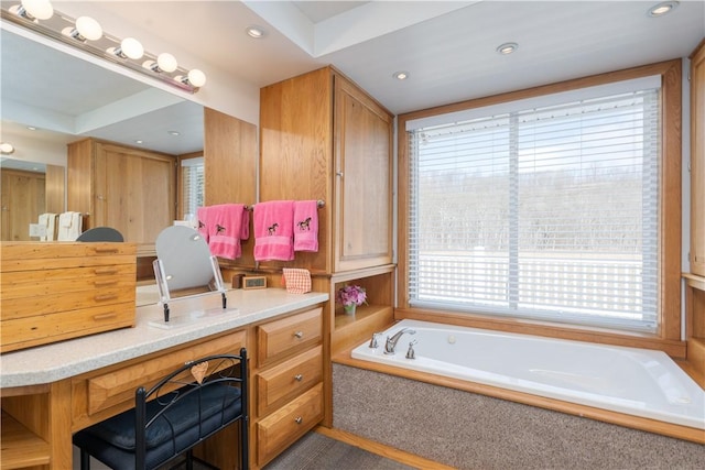 full bathroom featuring recessed lighting, vanity, and a garden tub