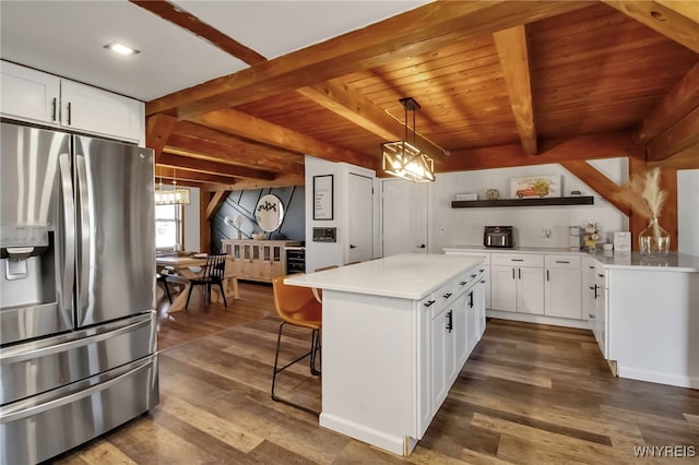 kitchen featuring beam ceiling, dark wood-type flooring, stainless steel fridge with ice dispenser, and white cabinetry