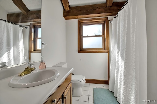 full bathroom with tile patterned flooring, baseboards, beamed ceiling, toilet, and vanity