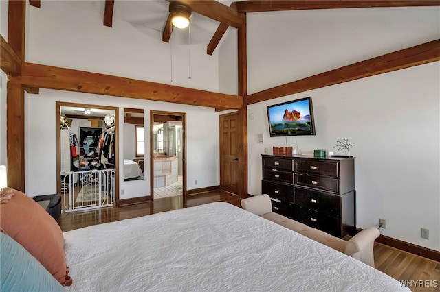 bedroom featuring ceiling fan, baseboards, beamed ceiling, wood finished floors, and high vaulted ceiling