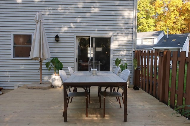 wooden terrace featuring outdoor dining space