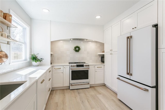 kitchen featuring tasteful backsplash, white cabinets, white appliances, and open shelves