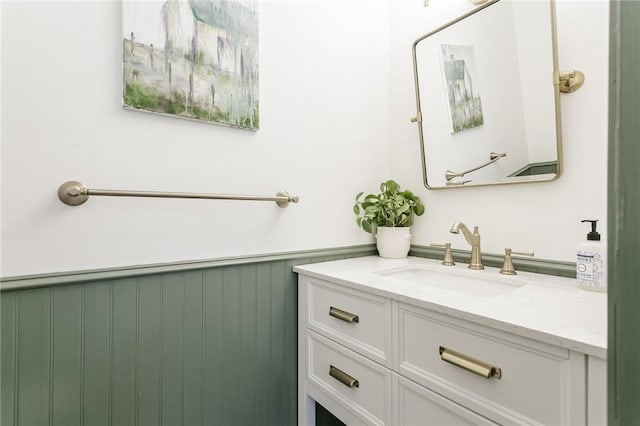 bathroom with vanity and wainscoting