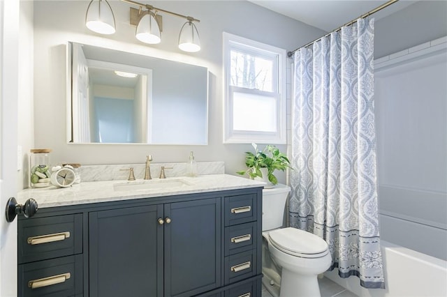 bathroom featuring vanity, toilet, and shower / bathtub combination with curtain