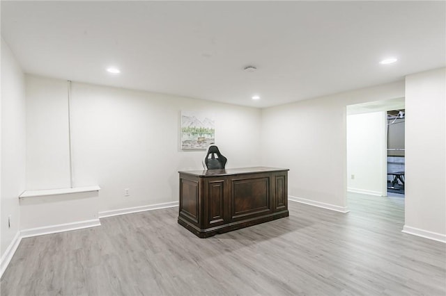 office area with recessed lighting, baseboards, and light wood-style flooring