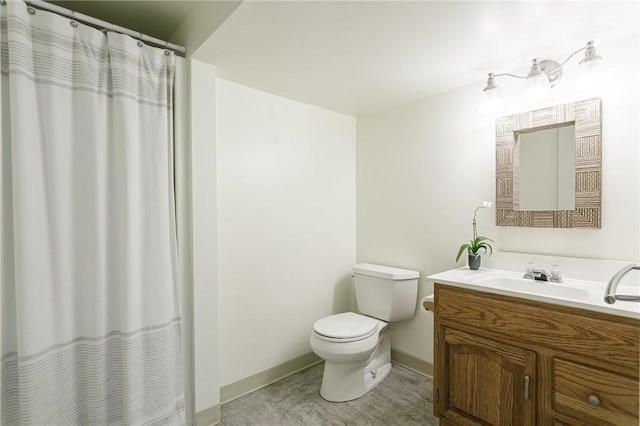 bathroom featuring vanity, a shower with curtain, baseboards, tile patterned flooring, and toilet