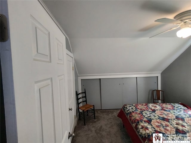 bedroom with a closet, carpet flooring, ceiling fan, and lofted ceiling