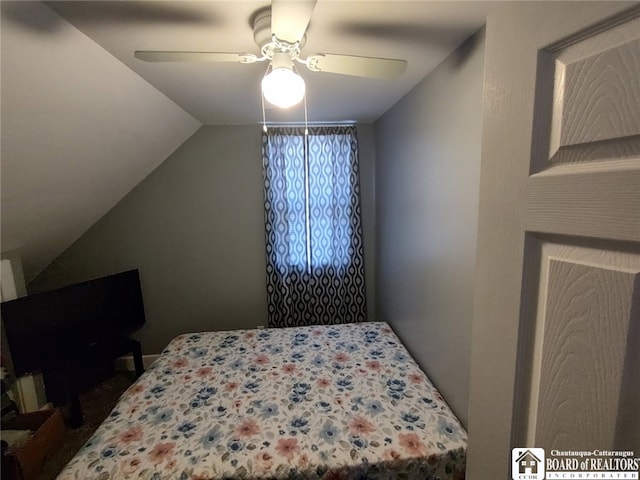 bedroom featuring lofted ceiling and ceiling fan