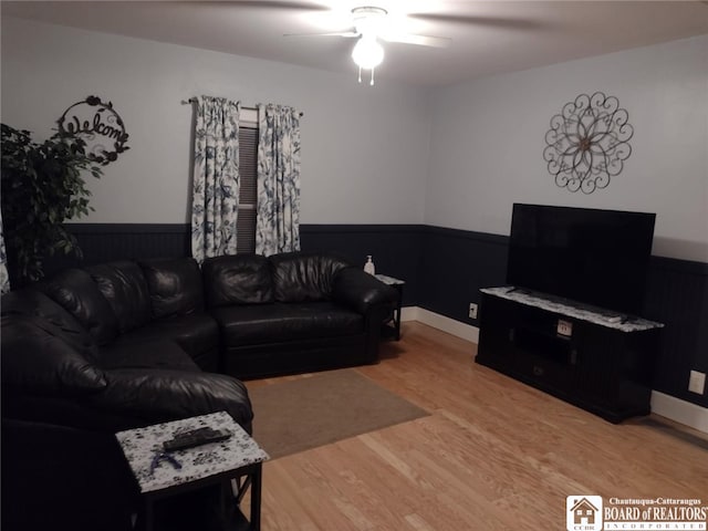 living room featuring ceiling fan and wood finished floors