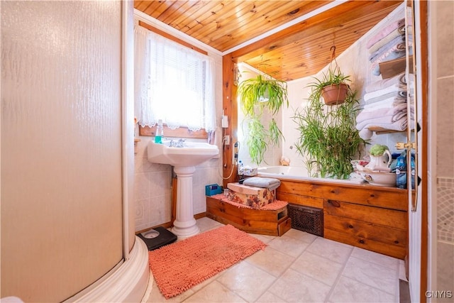 full bath with a bath, a shower stall, tile patterned floors, and wood ceiling