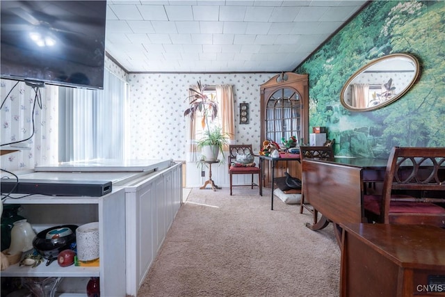 interior space with wallpapered walls, carpet, and ornamental molding