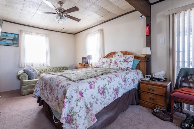 bedroom featuring carpet, ceiling fan, and crown molding