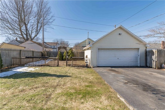 detached garage featuring fence