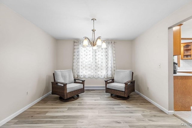 living area featuring a chandelier, baseboard heating, baseboards, and light wood-style floors