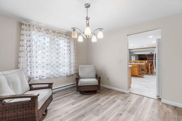 living area with baseboards, a baseboard radiator, recessed lighting, light wood-type flooring, and a chandelier