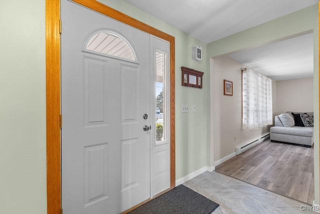 entrance foyer with baseboard heating and baseboards