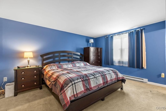 bedroom featuring baseboards, a baseboard heating unit, and carpet