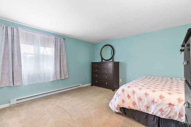 carpeted bedroom featuring baseboards and a baseboard radiator