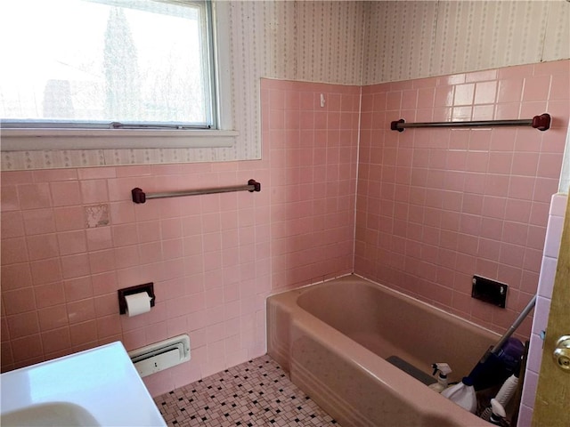 full bath featuring tile patterned floors, a wainscoted wall, tile walls, and wallpapered walls