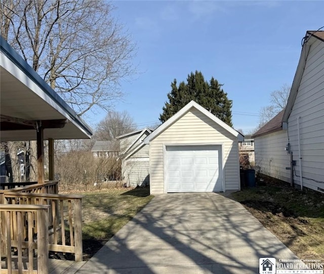 detached garage with concrete driveway