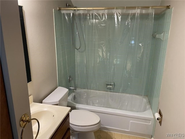 bathroom with vanity, toilet, and shower / bath combo with shower curtain