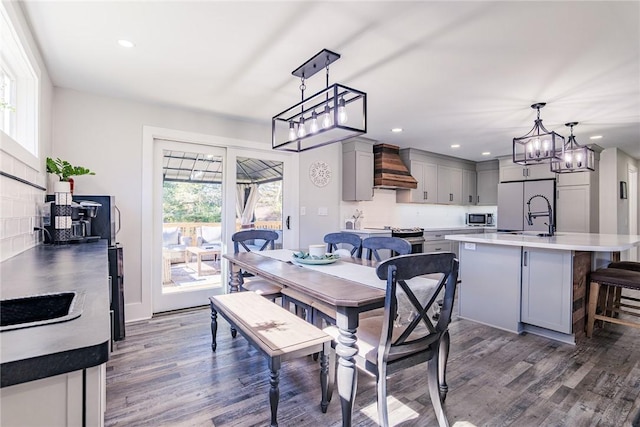 dining space with recessed lighting and dark wood-type flooring