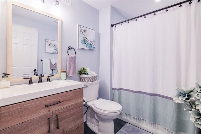 full bath with a shower with shower curtain, toilet, and vanity