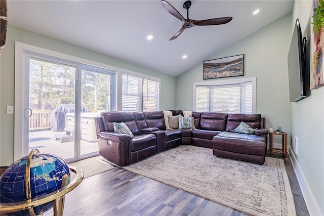 living room featuring baseboards, ceiling fan, vaulted ceiling, recessed lighting, and wood finished floors