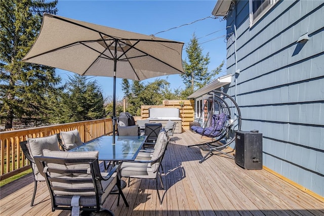 deck featuring a grill and outdoor dining space